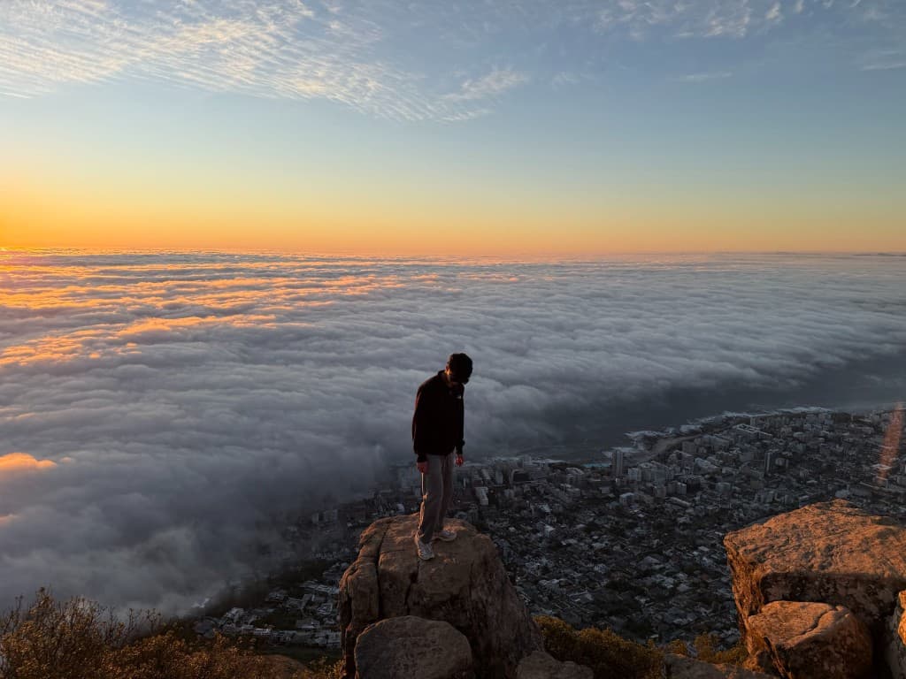 Sunrise above a sea of clouds covering Cape Town